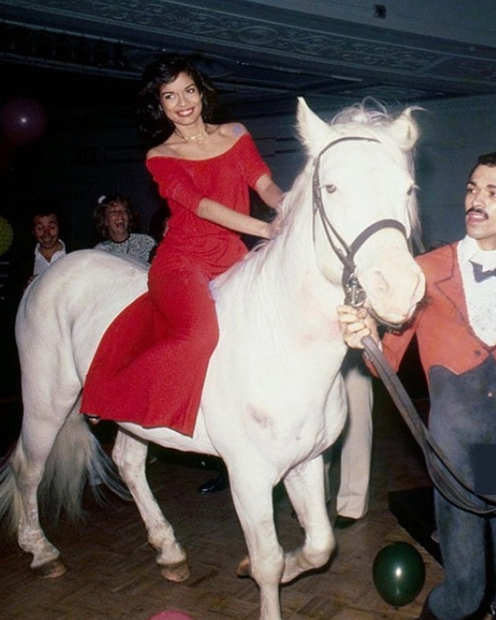 bianca jagger red dress Bianca Jagger wearing a red satin dress, 1970's. Photo: Oscar Abolafia/Everett Collection (biancajagger015 Stock Photo