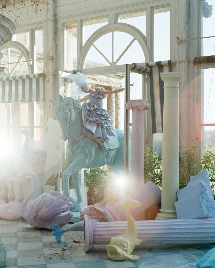 Olga Shearer on blue horse in Sennowe Park, Norfolk by Tim Walker, 2007.