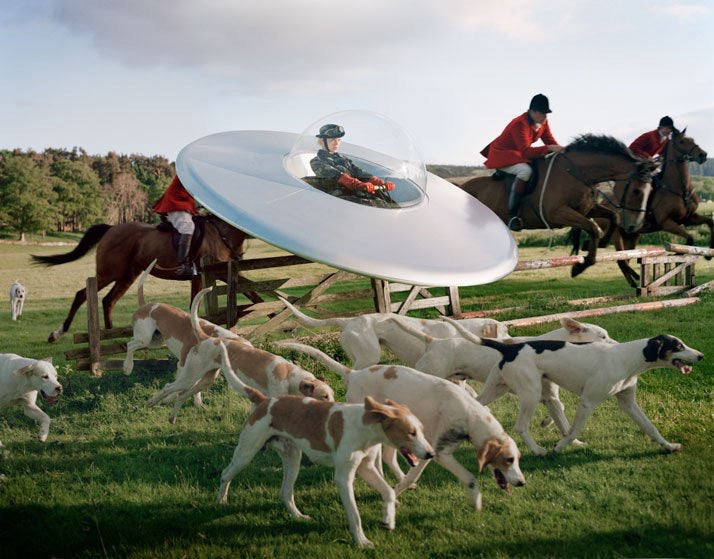 Kinga Rajzak in flying saucer with members of the West Percy Hunt by Tim Walker. Eglingham Hall, Northumberland, 2009.